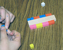 Student holding cubes