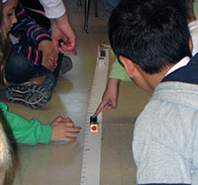 Students around a weight line