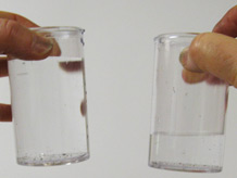 Hands with two different volumes of water