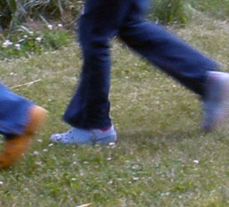 running feet on grass