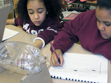 Students making observations of 2-bottle system
