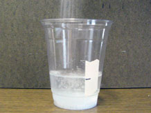 Adding salt to a cup of water