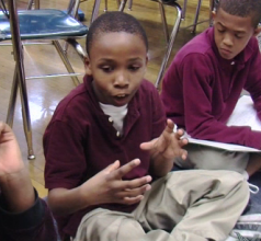 Photograph of a boy talking